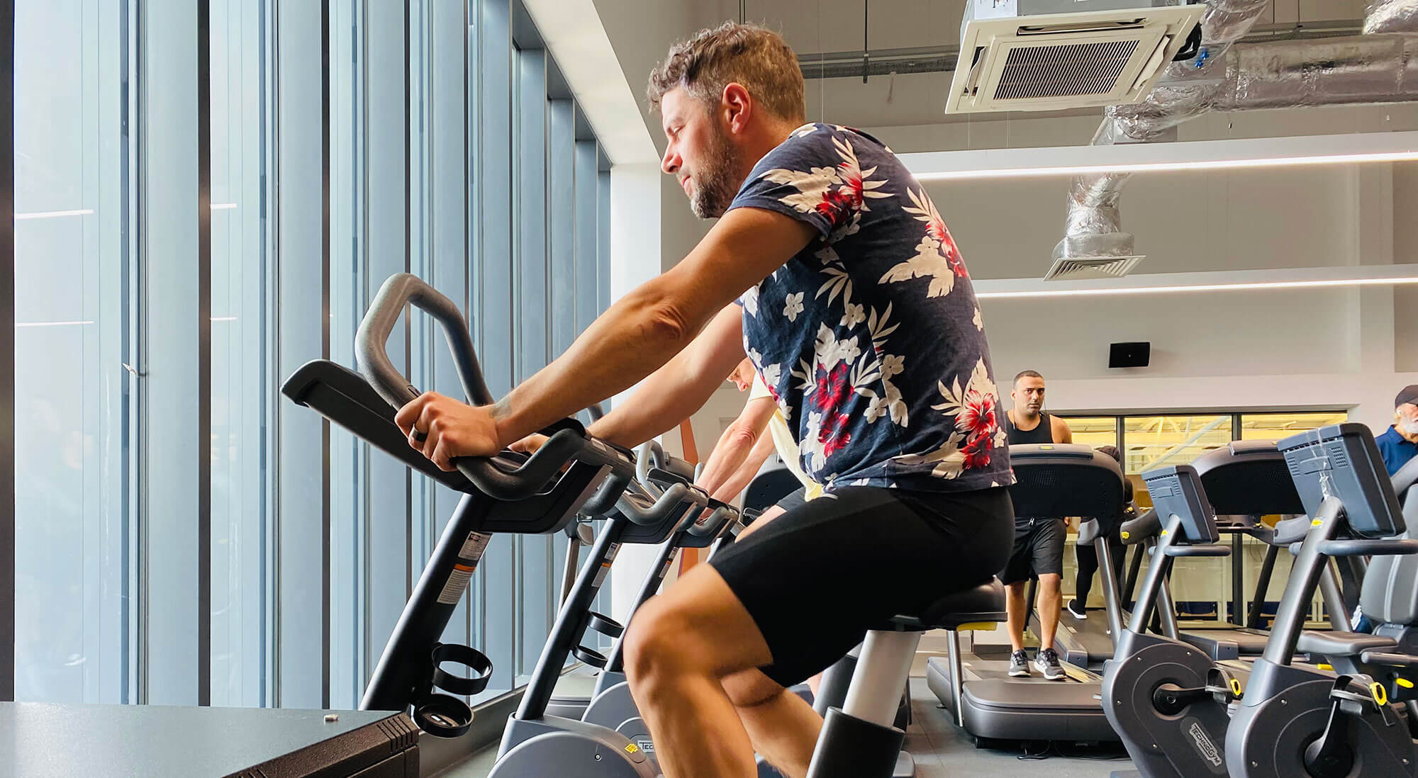 Image of a person on a bike in the gym at The Alan Higgs Centre