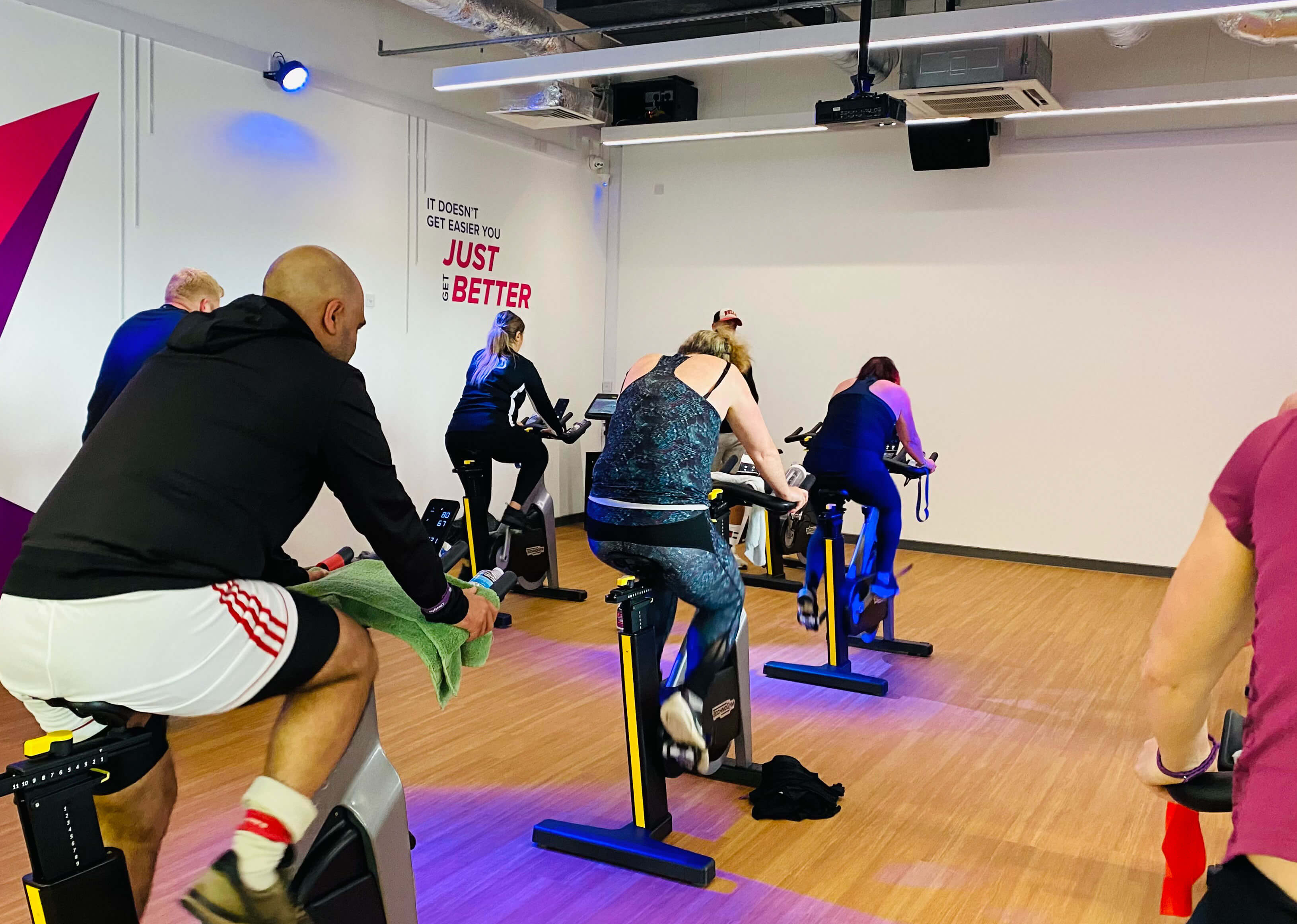 Group Exercise Class - Group Cycle at The Alan Higgs Centre with disco lighting